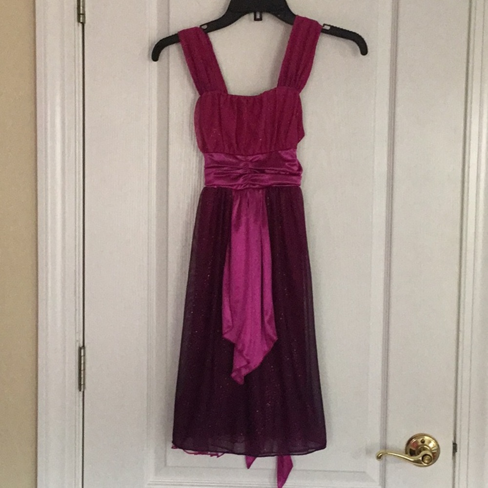 It’s a pink and purple formal dress.